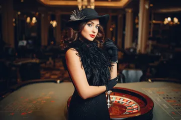 BA98 Live Casino — Join thrilling real-dealer tables A professional dealer in a tuxedo greeting players at the roulette table, symbolizing the authentic live casino feel at BA98.