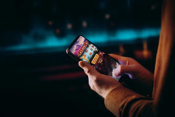 BA98 Casino Games — Enjoy nonstop entertainment A close-up shot of golden coins falling around a spinning roulette wheel, representing immersive casino action at BA98.